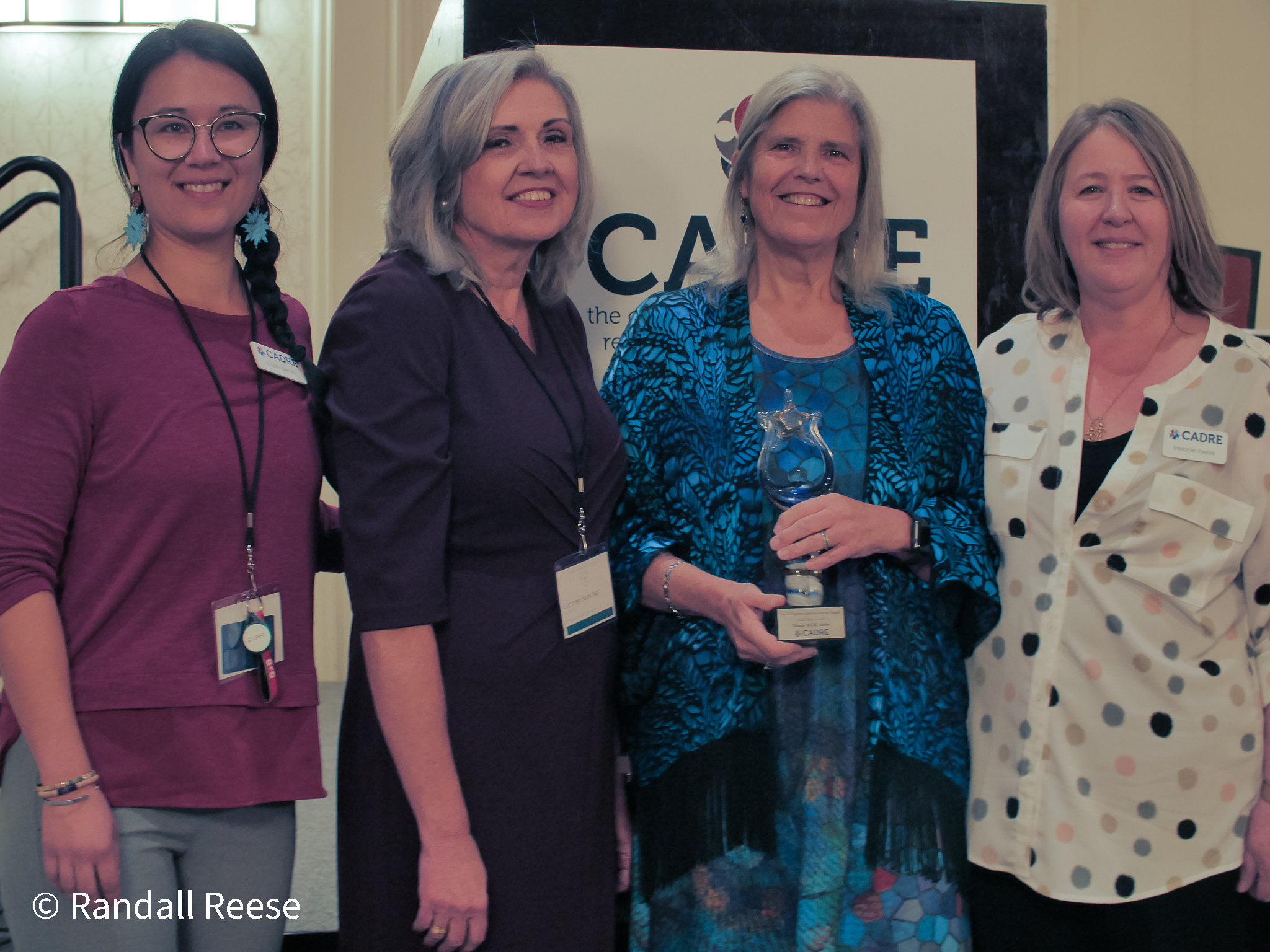 Photo of CADRE Staff with Diana MTK Autin and Project Officer Carmen Sanchez